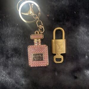 Pink and gold Rhinestone Perfume Bag
Charm/Keychain. NWOTwith Louis Vuitton lock